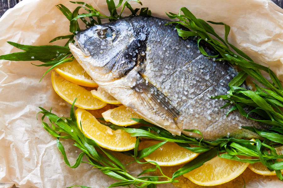 diet-sea-dorado-fish-prepared-baking-with-lemon-fresh-herbs-close-up (1).jpeg