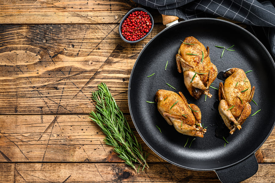 homemade-roast-quail-pan-wooden-background-top-view-copy-space (1).jpeg