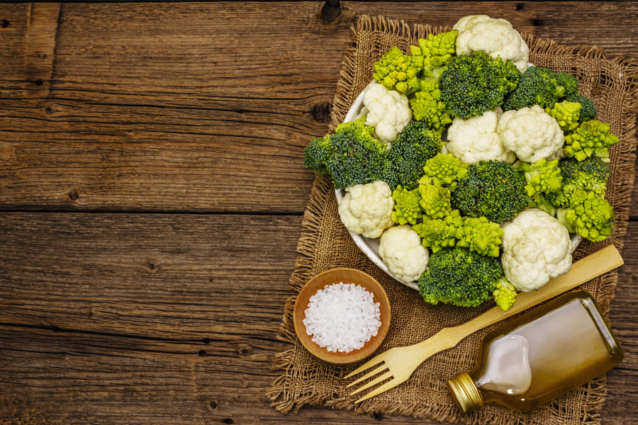 assorted-broccoli-romanesco-cauliflower-fresh-ripe-ingredient-healthy-food-old-wooden-boards-background-top-view (1).jpeg