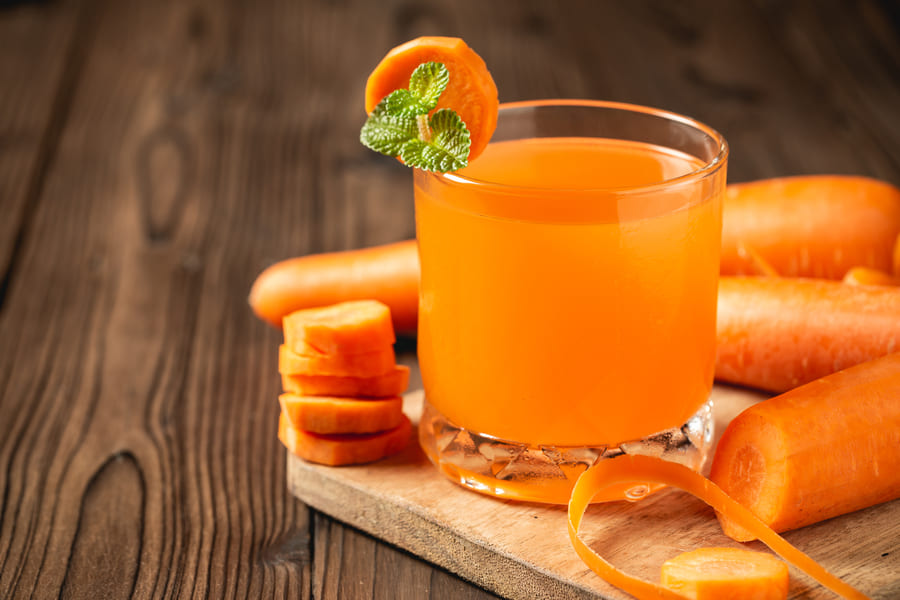 carrot-juice-glass-wooden-table (1).jpeg