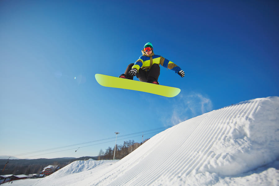 snowboarder-jumping-through-blue-sky (1).jpeg