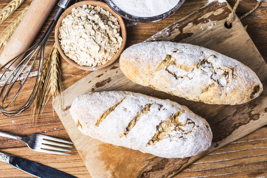 freshly-baked-traditional-bread-wooden-table-oatmeal-bread (1).jpeg