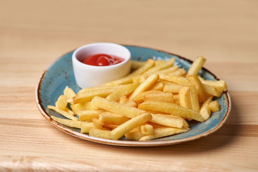french-fries-plate-standing-wooden-table (1).jpeg