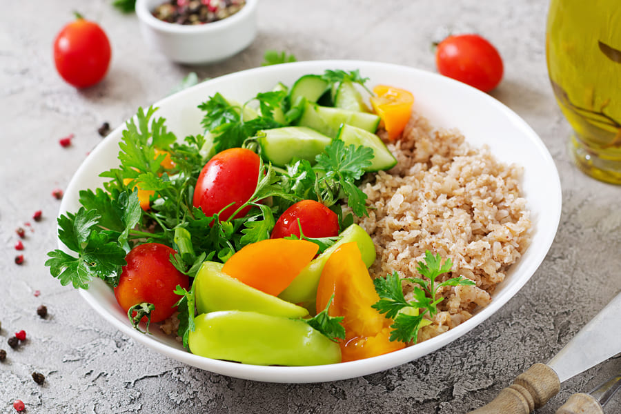 diet-menu-healthy-vegetarian-salad-fresh-vegetables-tomatoes-cucumber-sweet-peppers-porridge-bowl-vegan-food (1).jpg