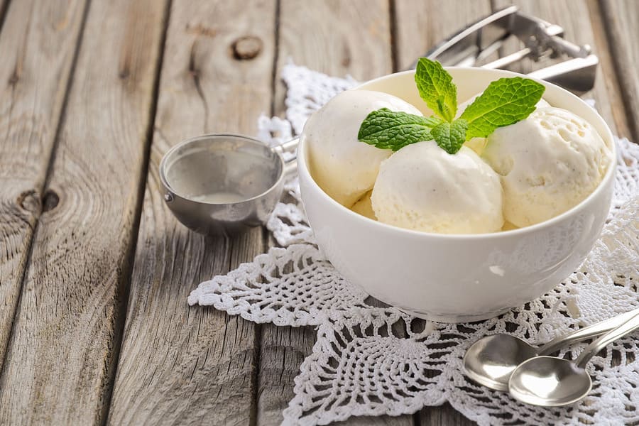 vanilla-ice-cream-with-mint-leaves-white-bowl-rustic-wooden-table (1).jpeg
