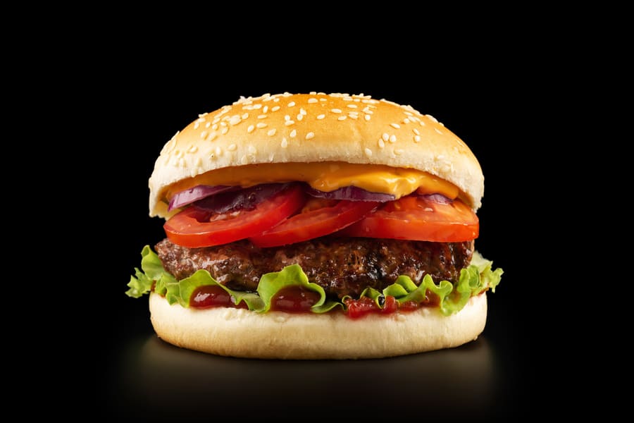 fresh-juicy-burger-black-background (1).jpeg