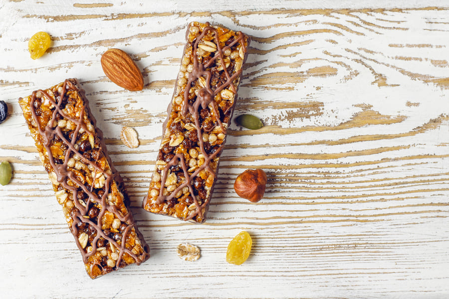 healthy-delicios-granola-bars-with-chocolate-muesli-bars-with-nuts-dry-fruits-top-view (1).jpeg