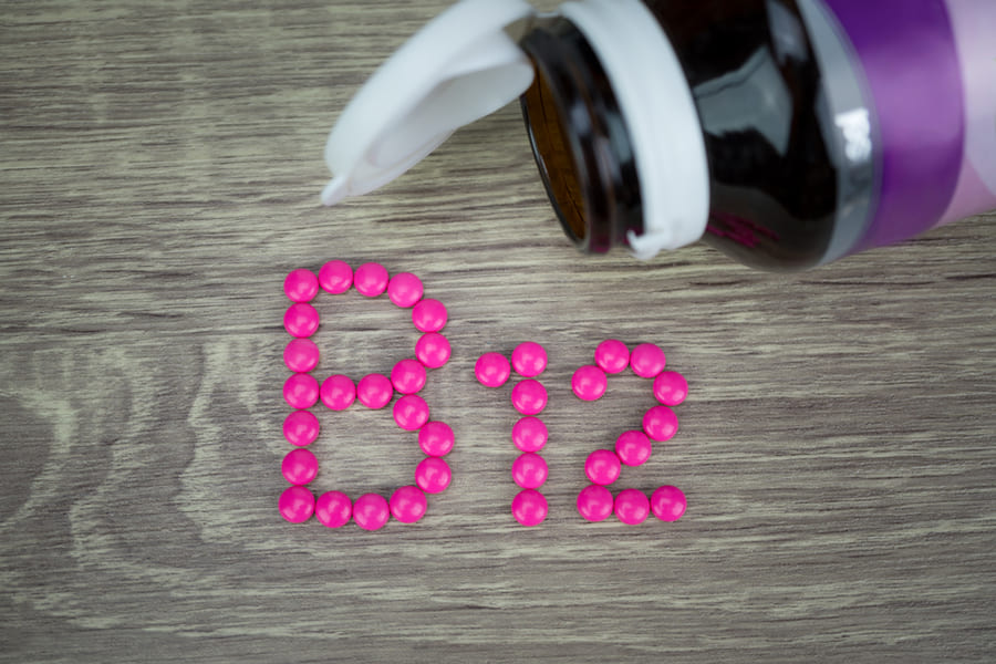 pink-pills-forming-shape-b12-alphabet-wood-background (1).jpeg