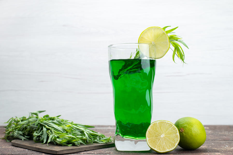 front-view-fresh-tarragon-drink-inside-long-glass-with-lemons-fresh-tarragon-leaves-white-tarragon-green-drink-juice (1).jpeg