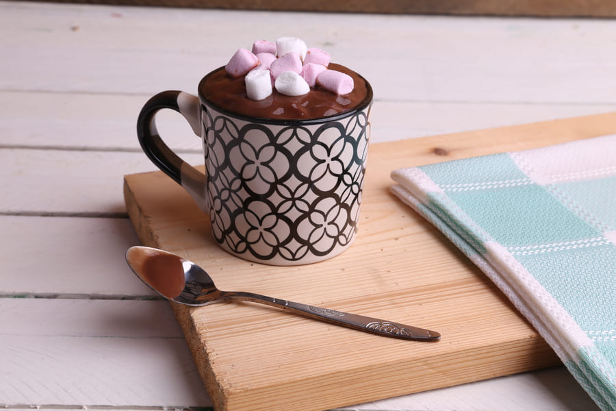 high-angle-shot-cup-hot-chocolate-with-marshmallows-wooden-surface (1).jpeg