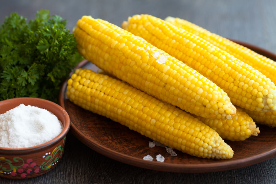 boiled-corn-with-solt-plate-wooden-background (1).jpeg