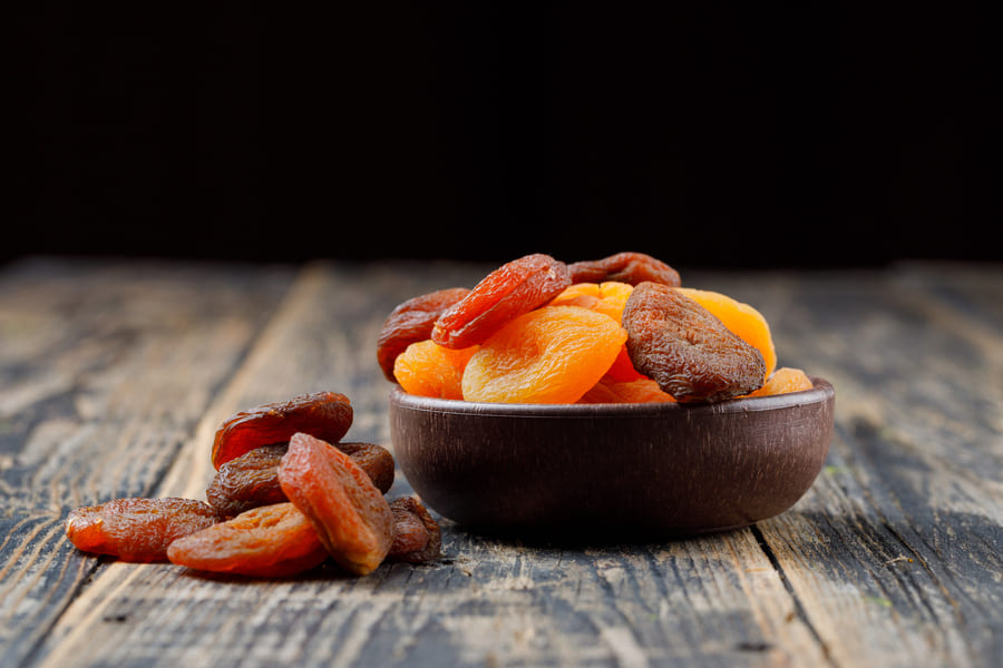 dried-apricots-clay-bowl-wooden-table (1).jpeg